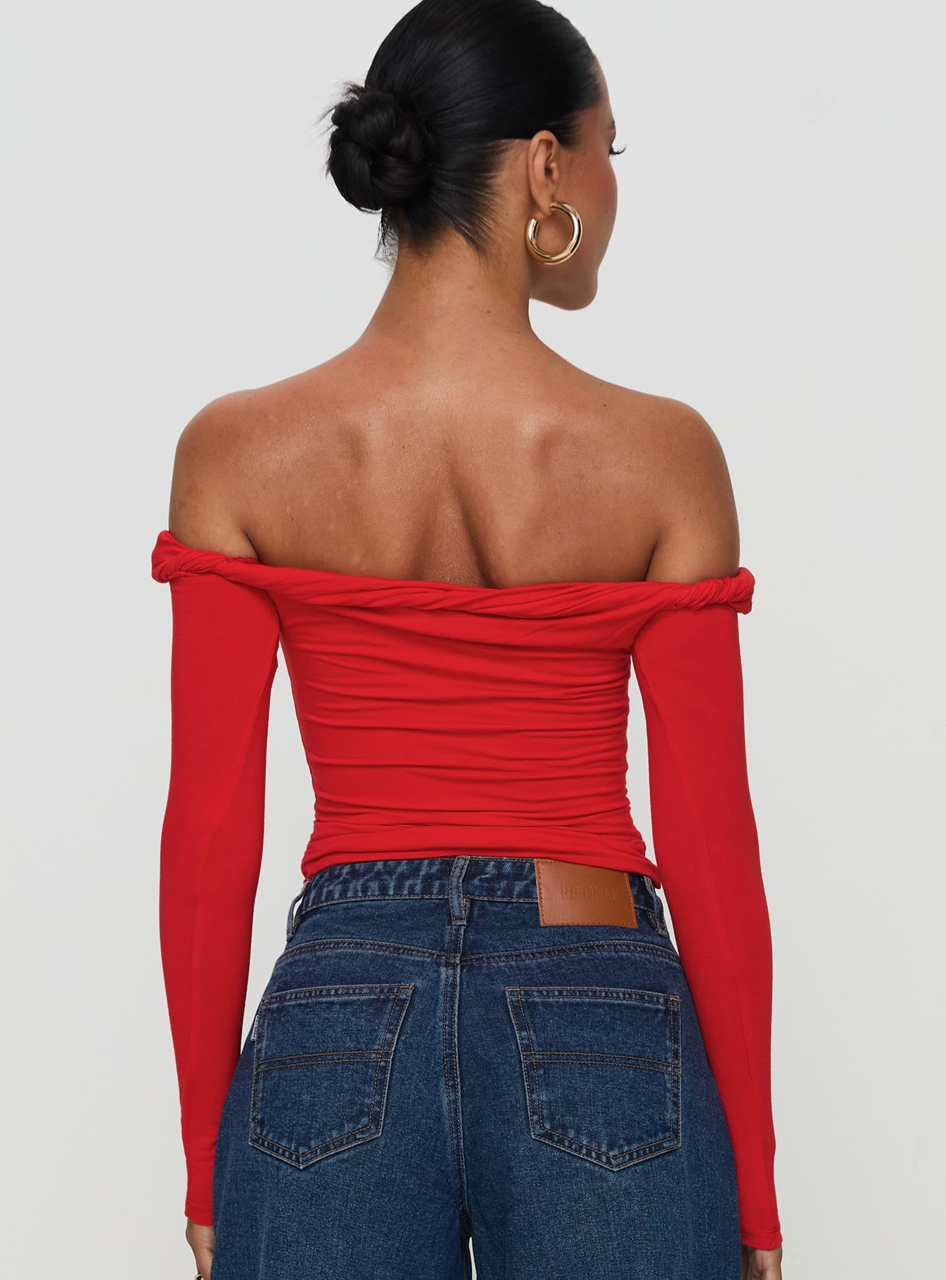 back view of model wearing Princess Polly Dusky Long Sleeve Top Red Full Sleeves straight 