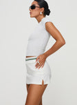 side view of model wearing Princess Polly Emberia Skort White High Waisted Shorts 