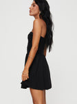 Front view of model wearing  front Princess Polly Asymmetric Neckline  Rashida Strapless Mini Dress Black