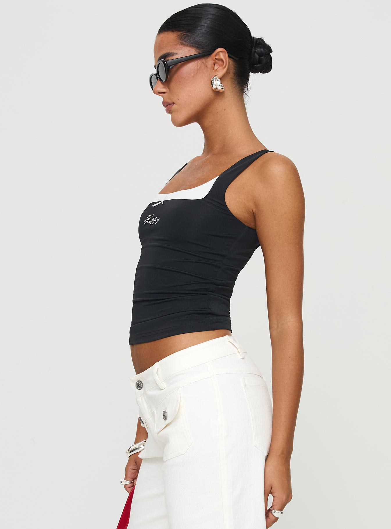 side view of model wearing Princess Polly All My Life Top Black Sleeveless Scoop Neck 