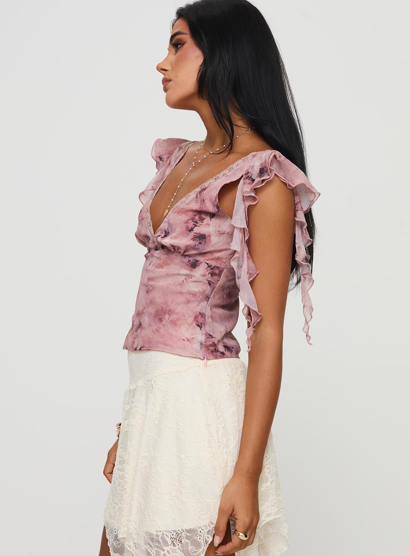 side view of model wearing Princess Polly Miztry Top Pink Short Sleeves V-Neck 