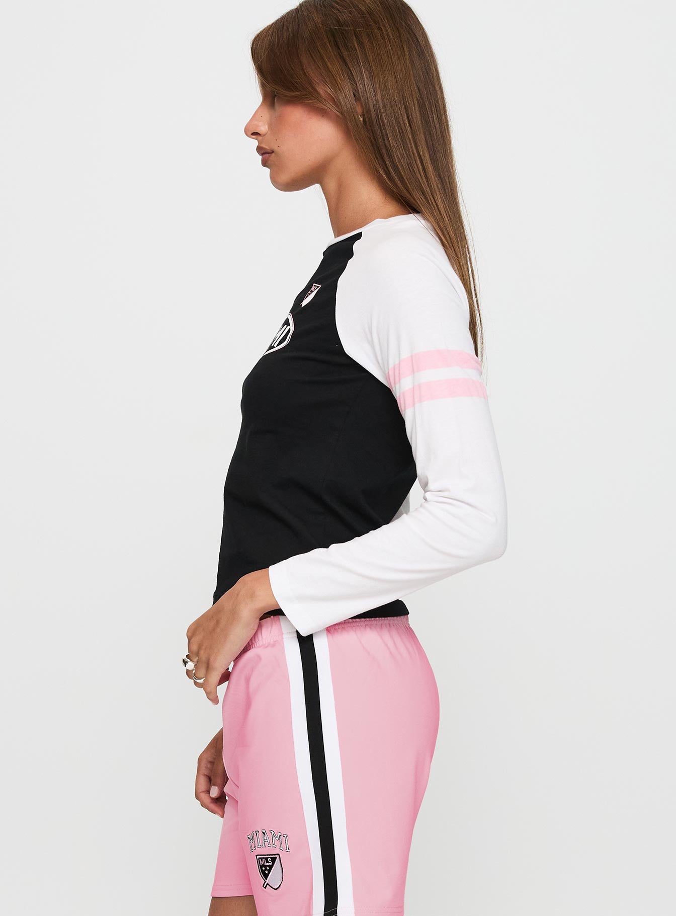 side view of model wearing Princess Polly Inter Miami Cf MLS Long Sleeve Black Full Sleeves Crew Neck 