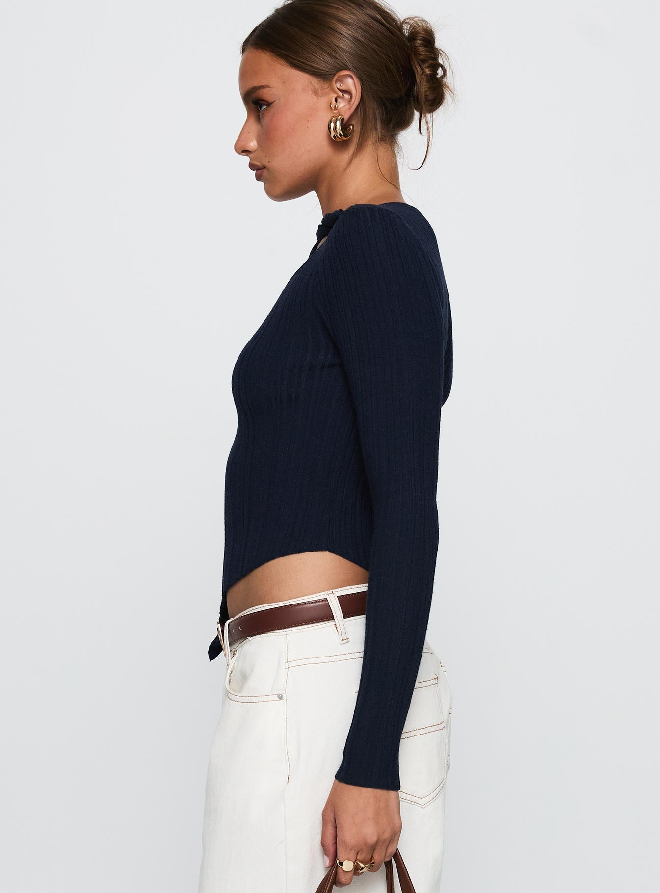 side view of model wearing Princess Polly Ellara Long Sleeve Top Blue Full Sleeves High Neck 