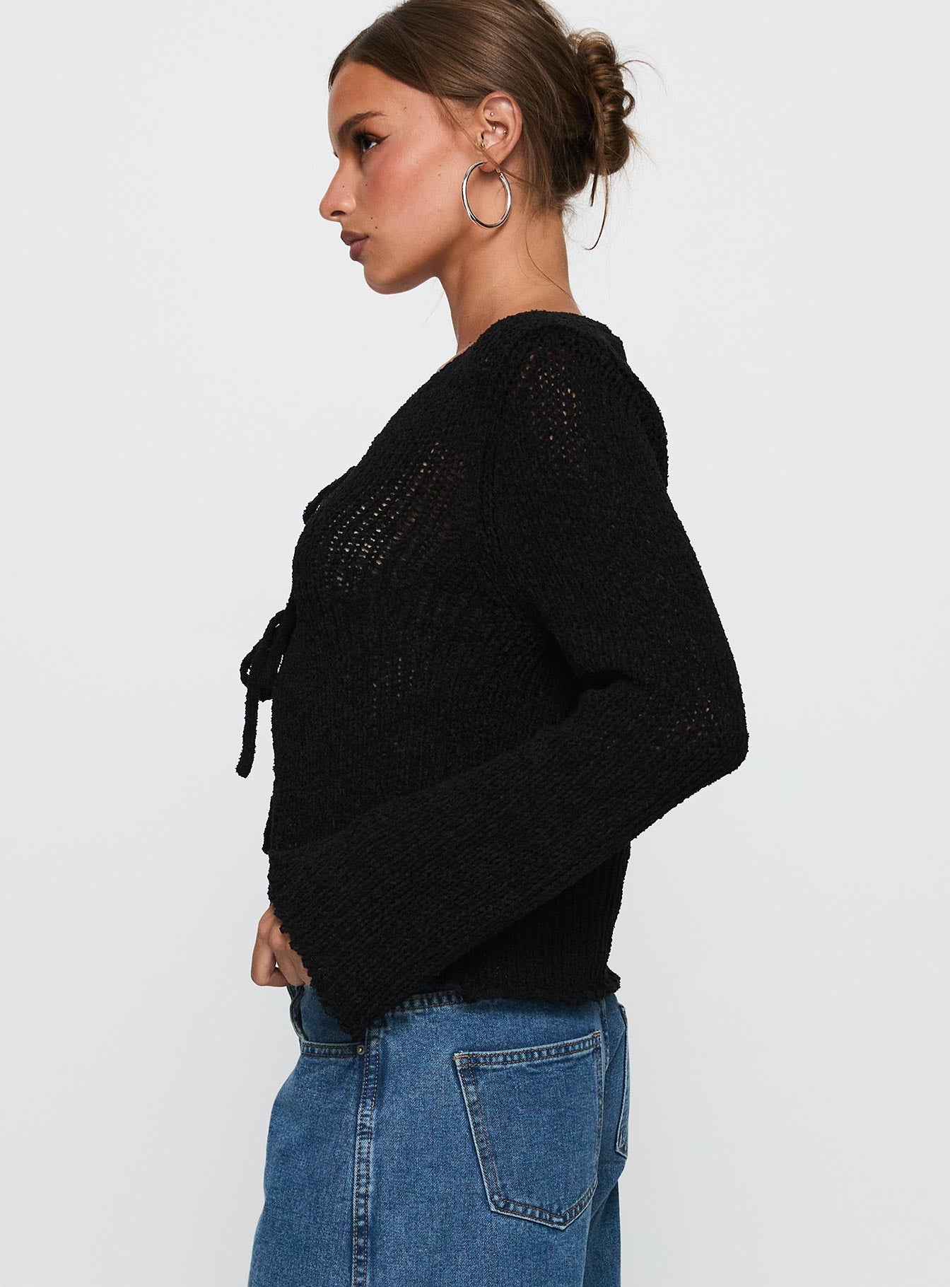 side view of model wearing Princess Polly Swain Knit Cardigan Black Cropped Jumpers 