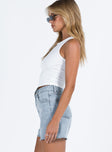 side view of model wearing Princess Polly Laurena Denim Shorts Tall Lower Impact High Waisted Shorts 