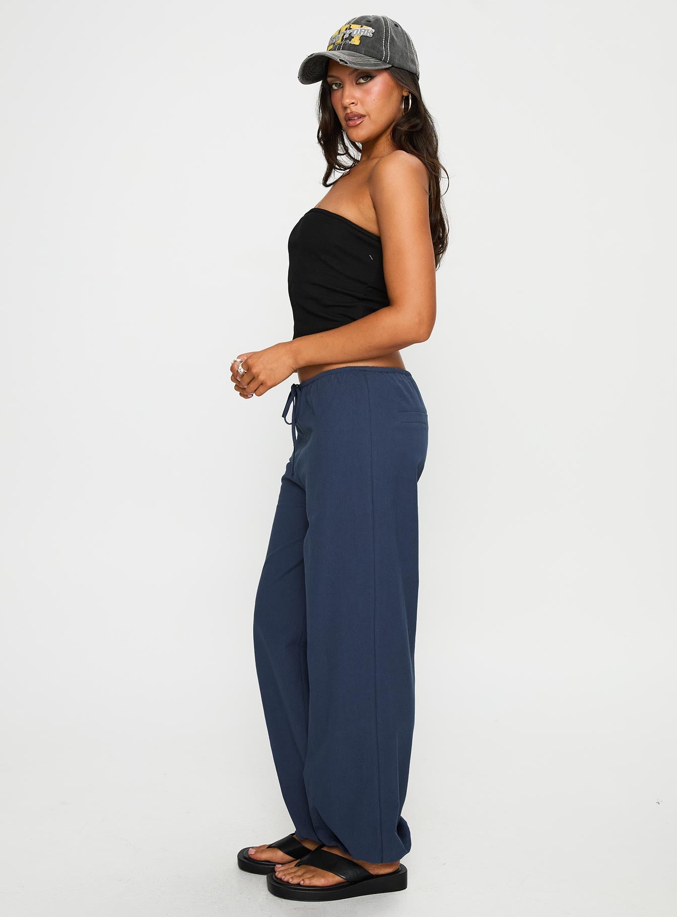 side view of model wearing Princess Polly Zodie Low Waist Pants Navy Low Rise Pants 