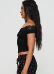 side view of model wearing Princess Polly Amarena Off The Shoulder Lace Top Black Short Sleeves 