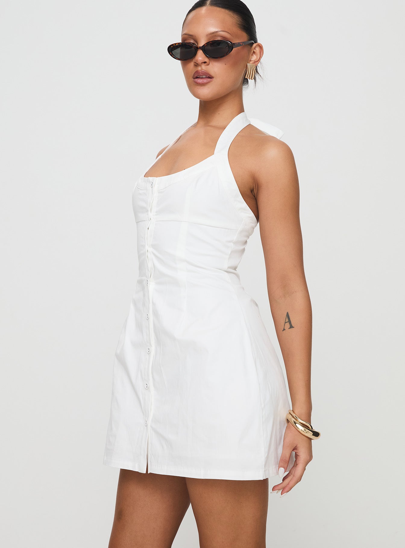 side view of model wearing Princess Polly Mallorie Halter Mini Dress White Scoop Neck 