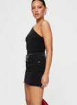   side view of model wearing Princess Polly Jellicoe Spliced Denim Skirt Black Wash Mini Skirts 