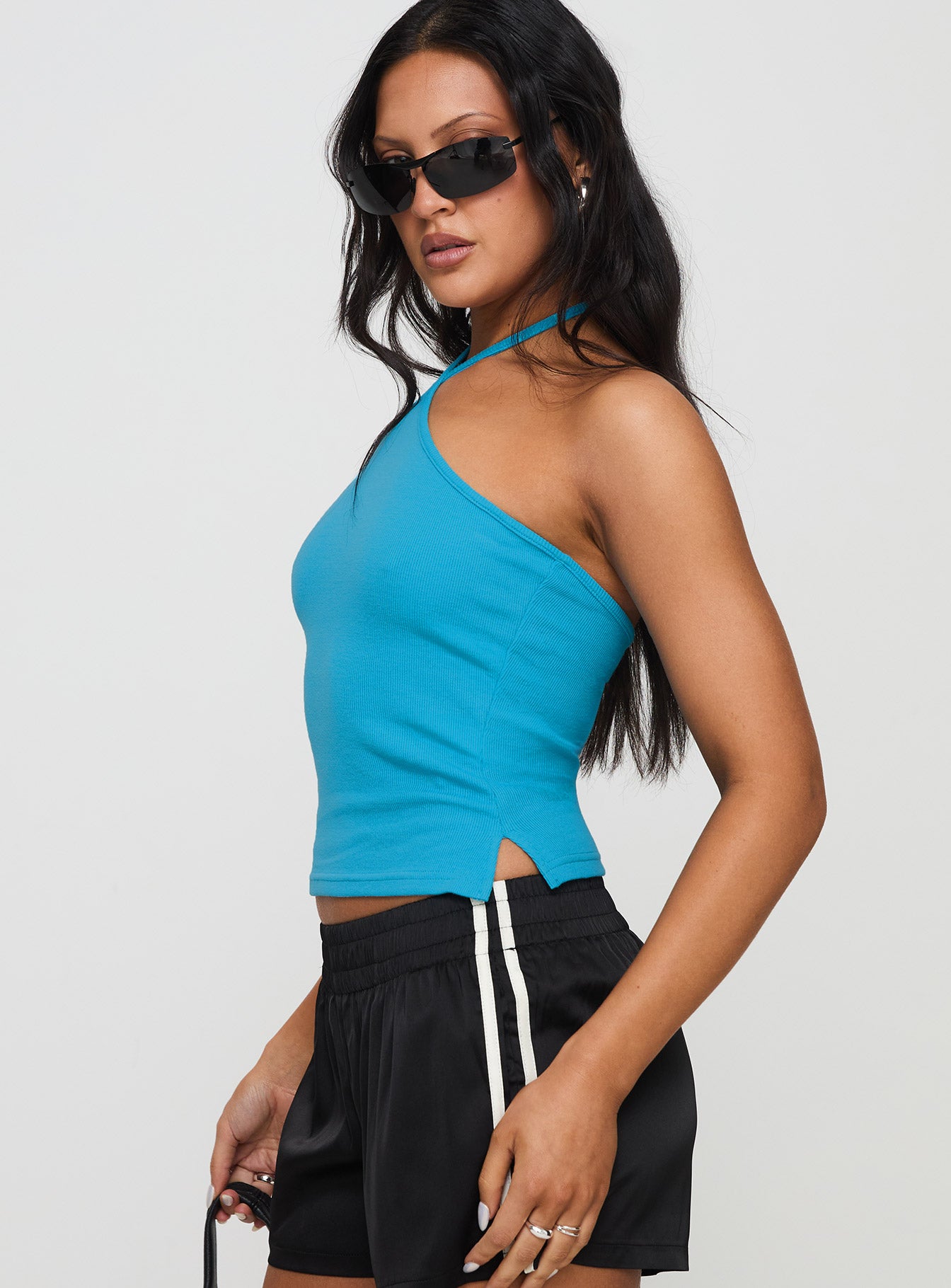 side view of model wearing Princess Polly Baseline Halter Rib Top Blue Sleeveless 
