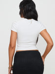 Front view of model wearing  front Princess Polly Short Sleeves Crew Neck  Baseline Scoop Rib Tee White