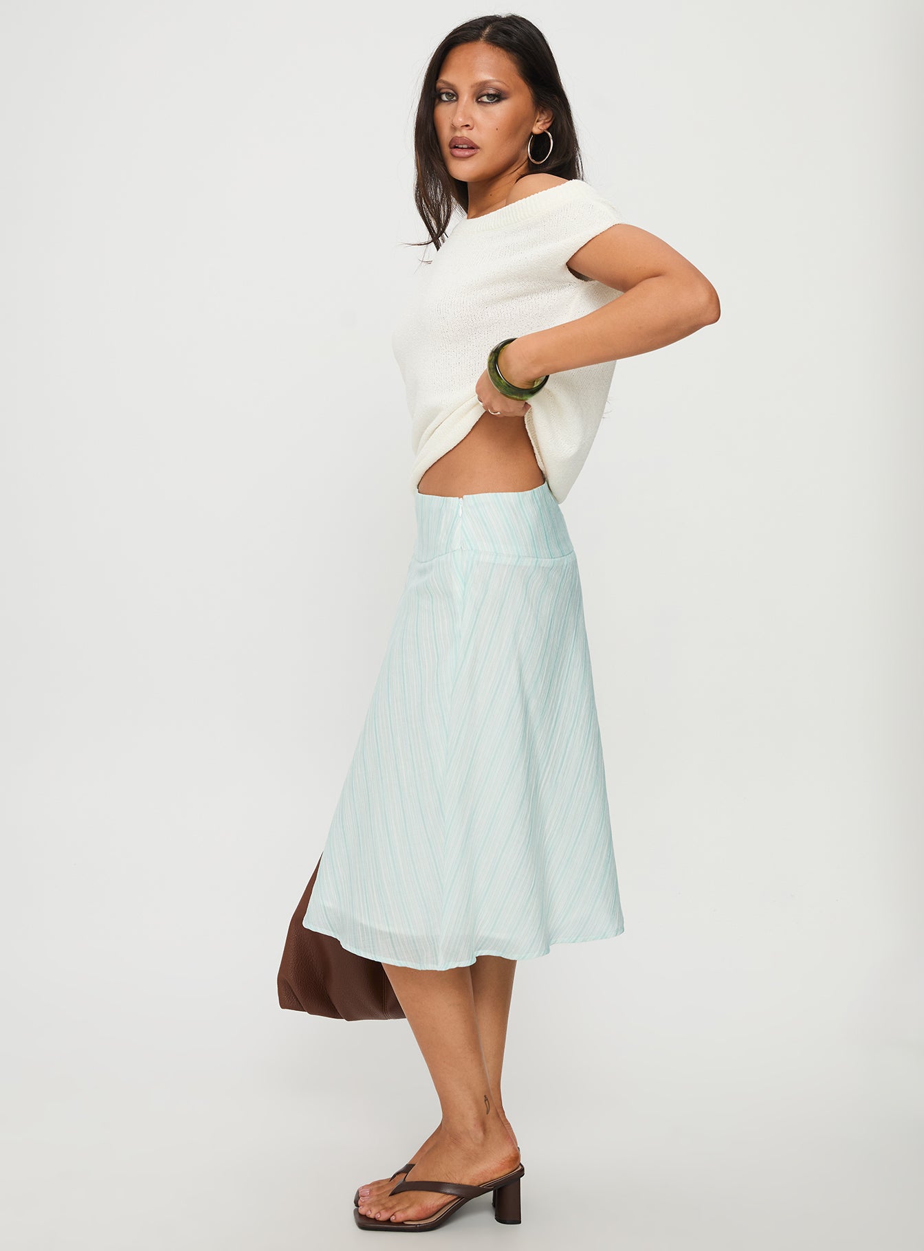   side view of model wearing Princess Polly Alunara Midi Skirt Aqua Stripe Midi Skirts 