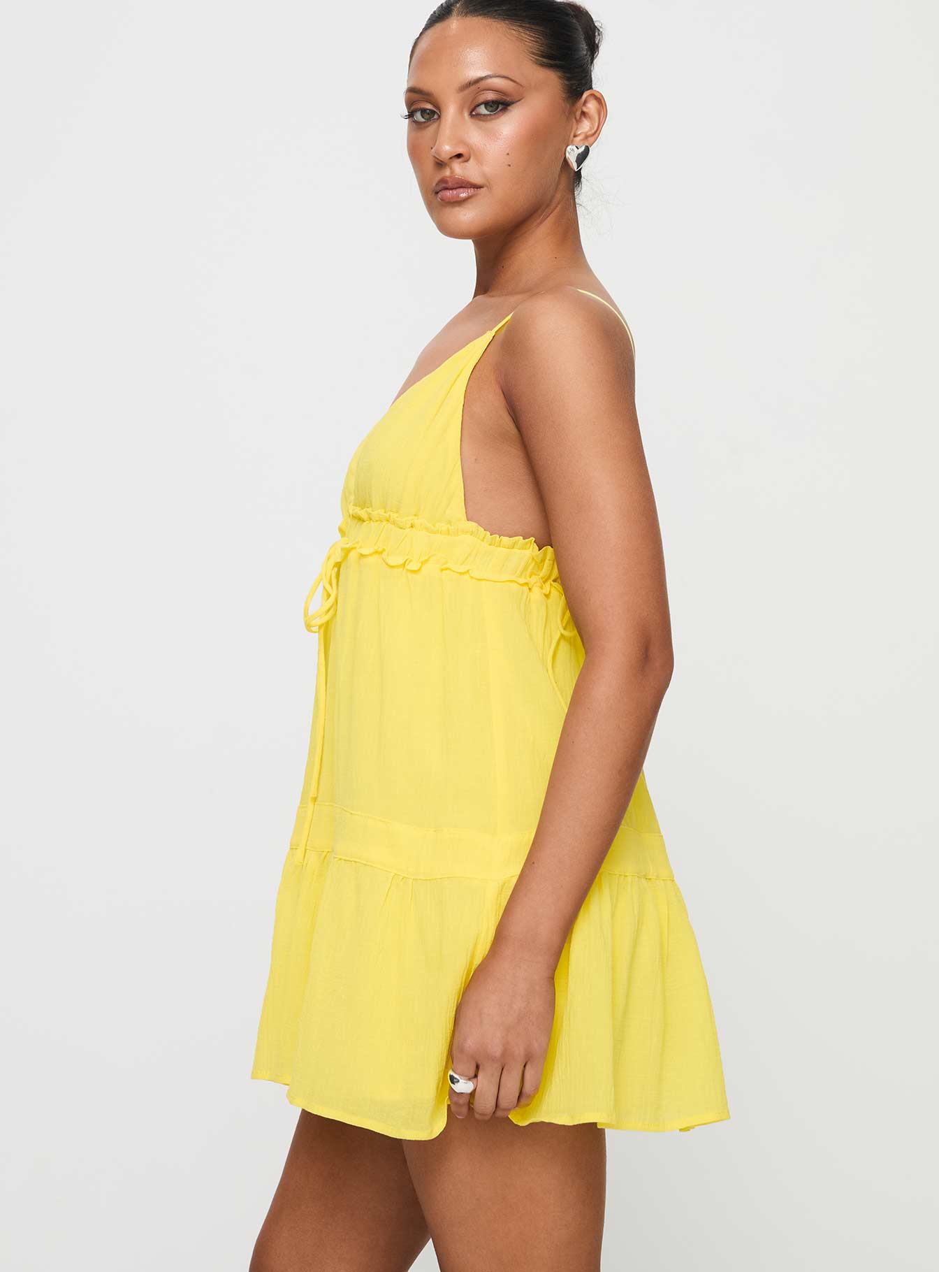 side view of model wearing Princess Polly Dionne Mini Dress Lemon Plunger 