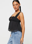 side view of model wearing Princess Polly Mooney Top Black Sleeveless Square Neck 