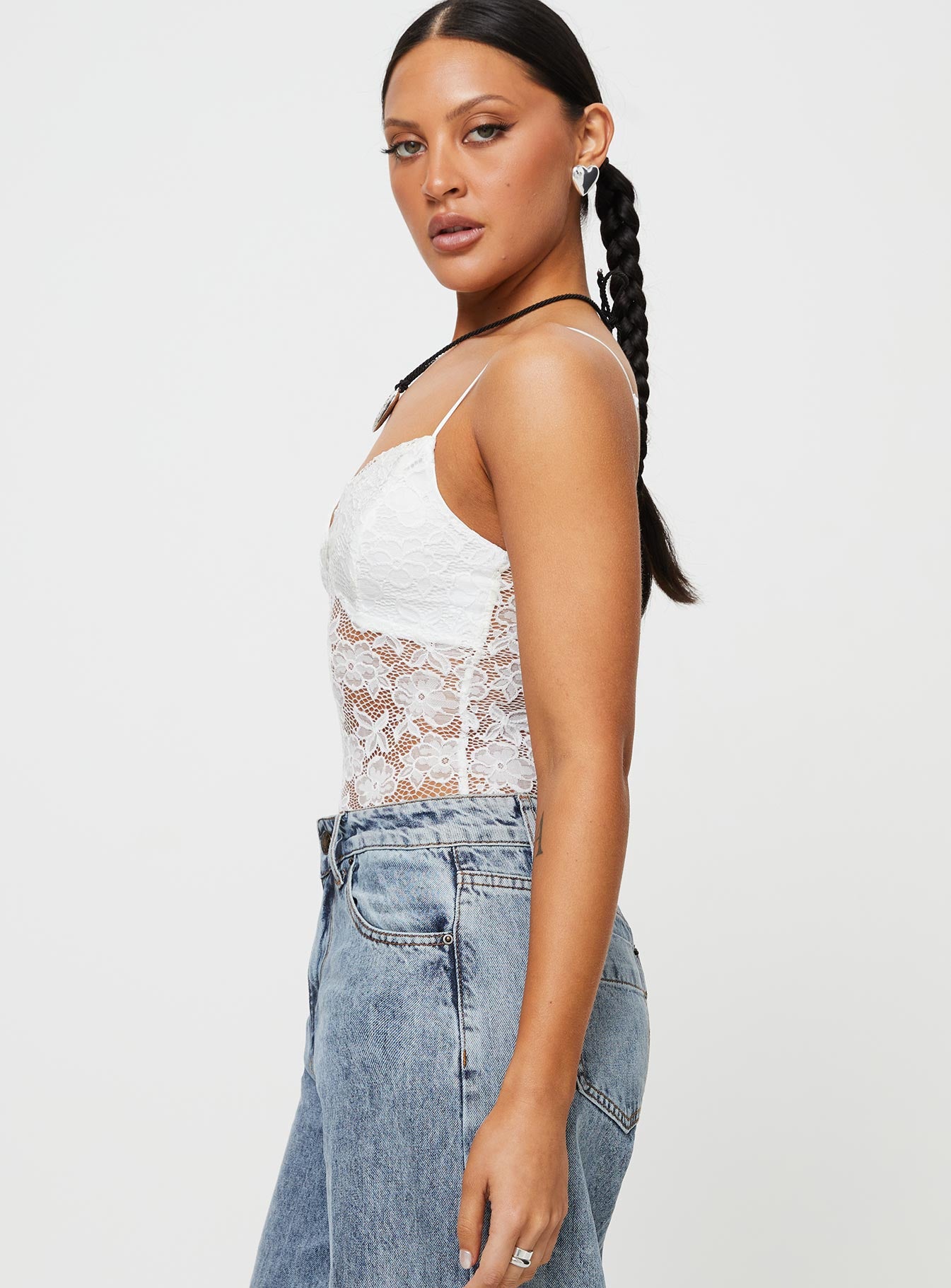 side view of model wearing Princess Polly Pennard Lace Bodysuit White Sleeveless 