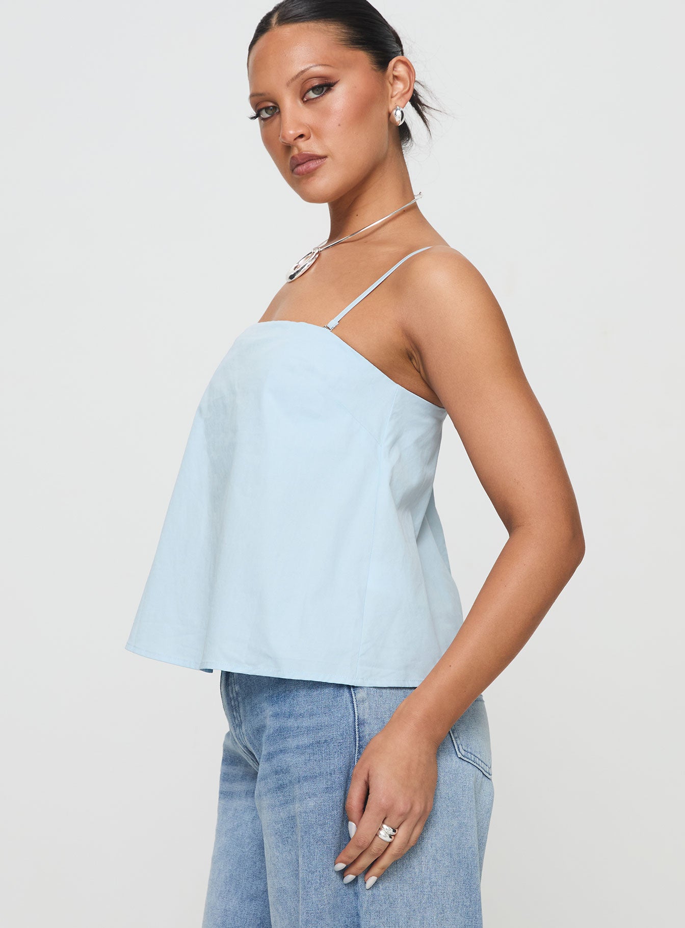 side view of model wearing Princess Polly Trapeze Strapless Top Blue Sleeveless Square Neck 
