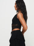 side view of model wearing Princess Polly Damarie One Shoulder Top Black Sleeveless Asymmetric Neckline 