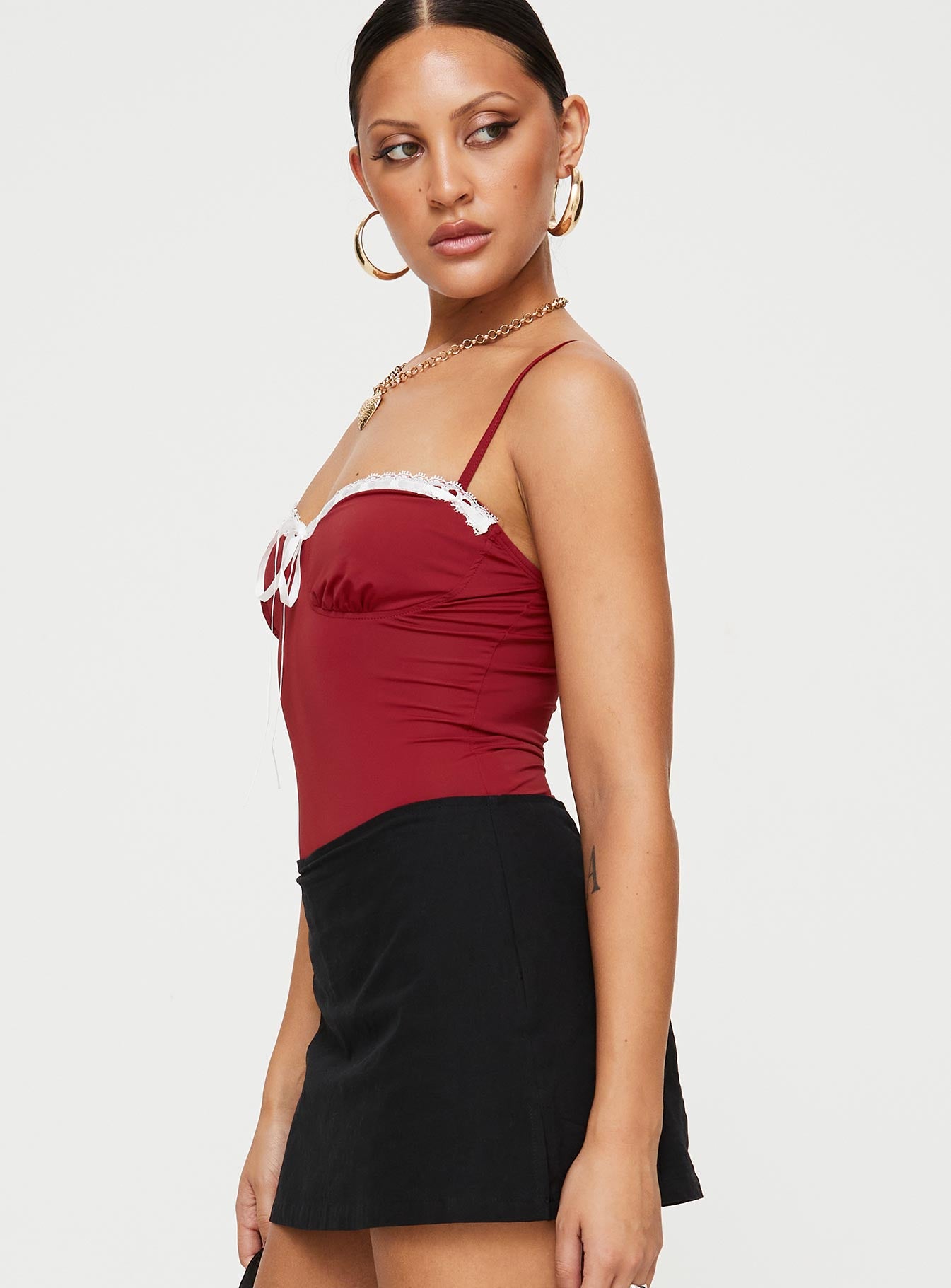 side view of model wearing Princess Polly Damsel Bodysuit Burgundy Sleeveless Sweetheart 