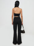 back view of model wearing Princess Polly Stellina Slim Fit Flared Pants Black High Waisted Pants 