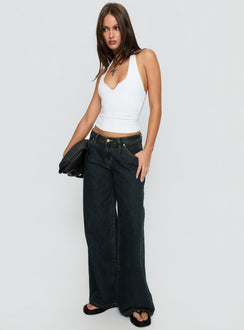 side view of model wearing Princess Polly Supercut Low Rise Baggy Pleat Jeans Grunge Wash Low Rise Jeans 