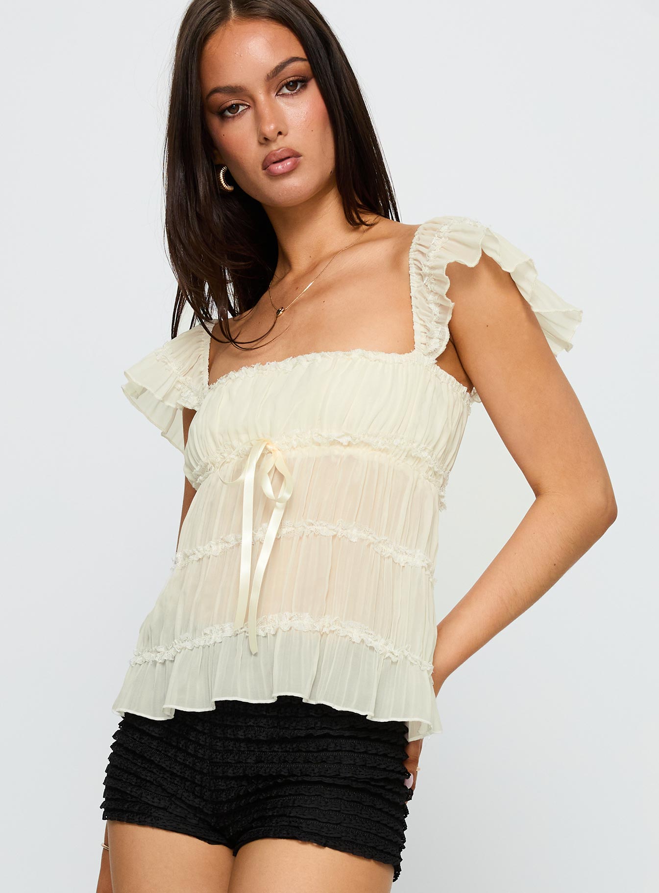 side view of model wearing Princess Polly Brighter Than Stars Tiered Top Cream Sleeveless Square Neck 