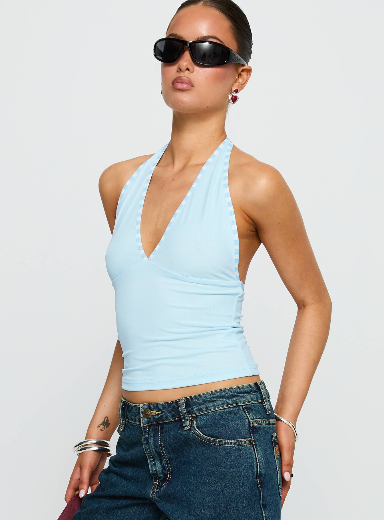 side view of model wearing Princess Polly Mirabelle Top Blue Sleeveless Plunger 