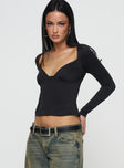 side view of model wearing Princess Polly Annistyn Top Black Full Sleeves Plunger 