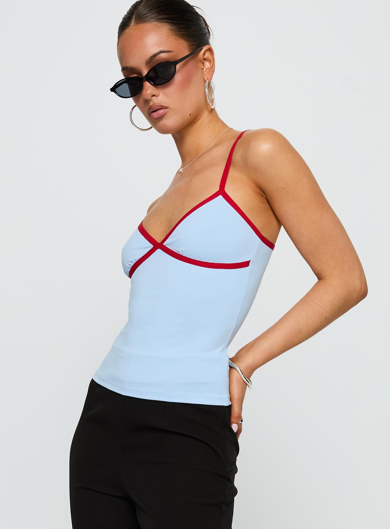 side view of model wearing Princess Polly Tiera Top Blue / Red Sleeveless V-Neck 
