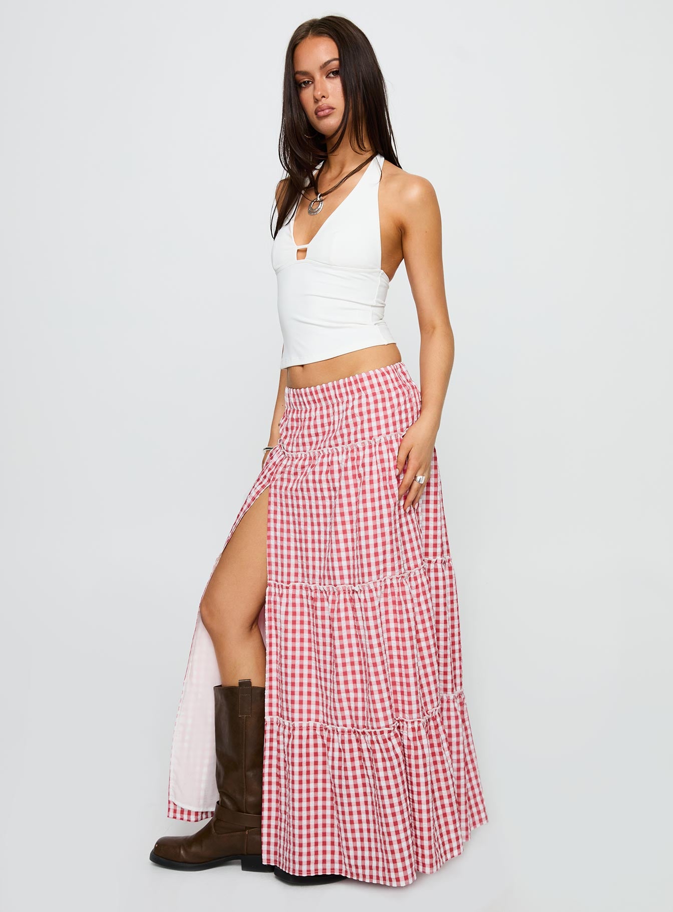   side view of model wearing Princess Polly Ilaina Tiered Maxi Skirt Red Check Maxi 