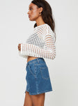 Mid wash denim mini skirt, mid rise Belt looped waist, zip and button fastening, four pockets Non-stretch material, unlined 