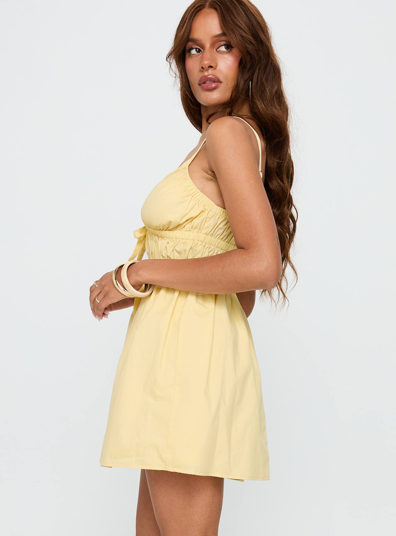 side view of model wearing Princess Polly Viviette Ruched Mini Dress Lemon Plunger 
