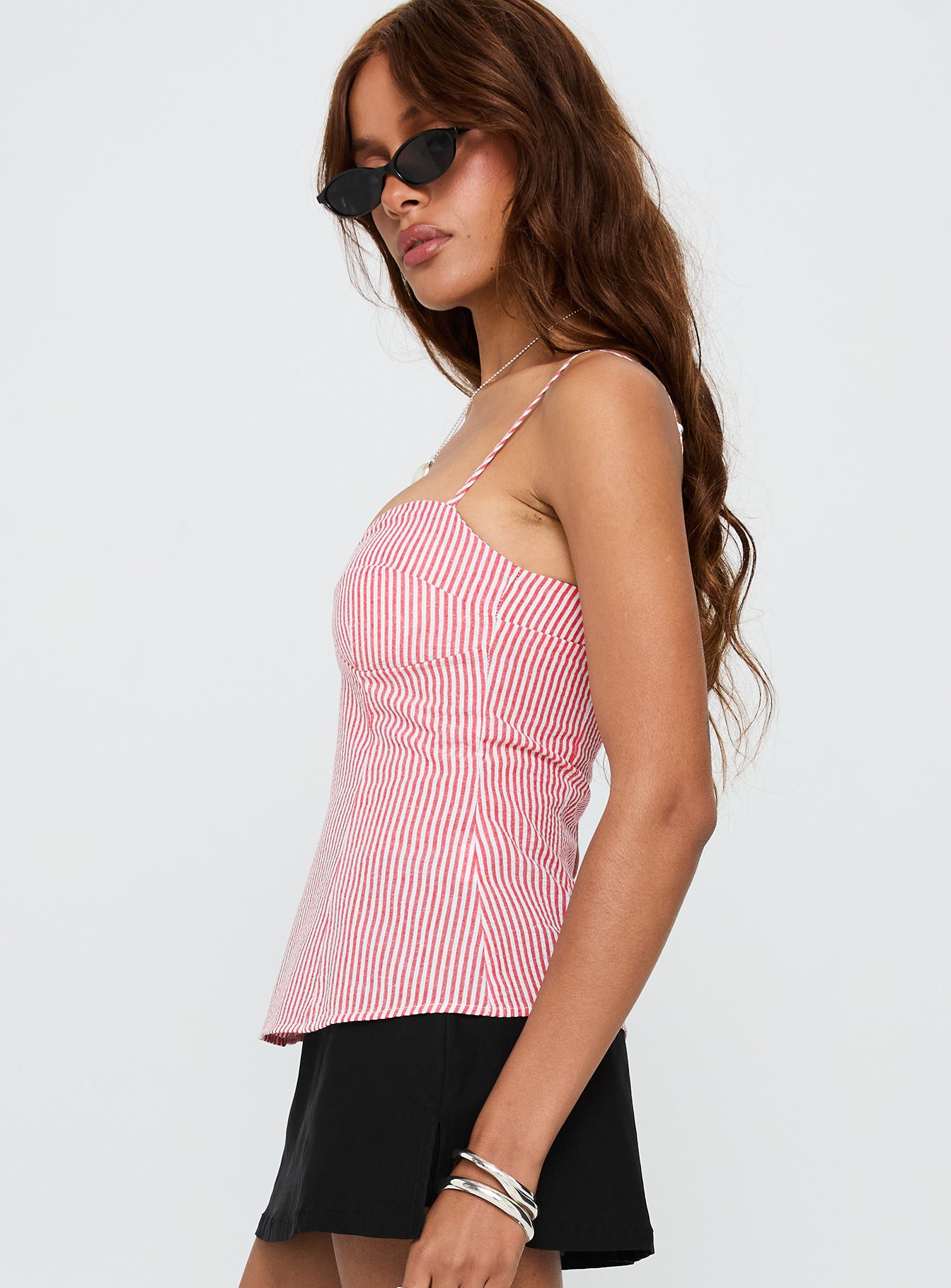 side view of model wearing Princess Polly In Your Palm Top Red Stripe Sleeveless Sweetheart 