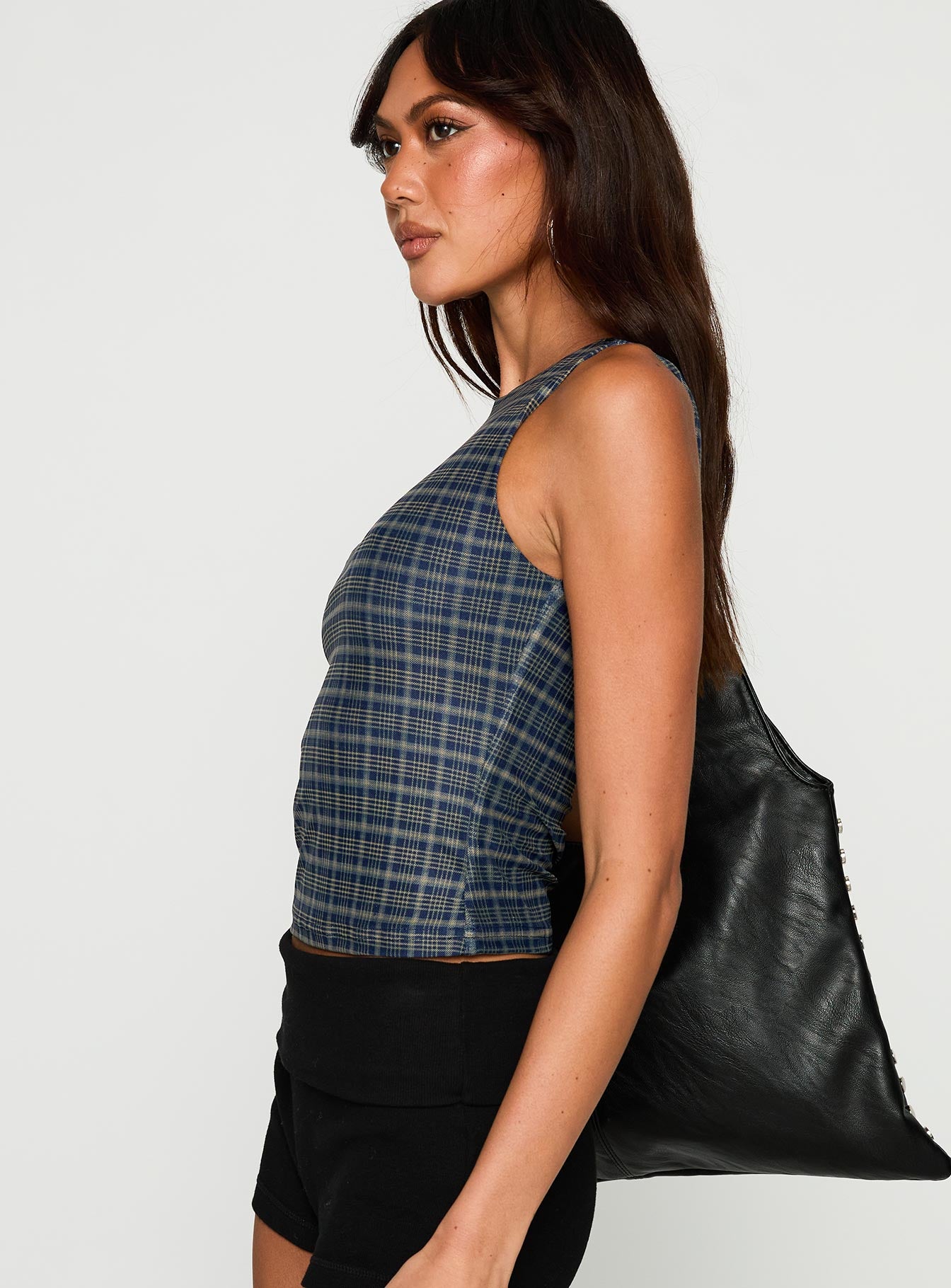 side view of model wearing Princess Polly Your Main One Top Navy Check Sleeveless Crew Neck 