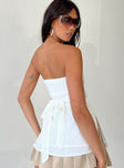 Strapless top Inner silicone strip at bust Shirred band at back  Waist tie fastening at back Split hem