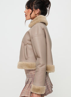 Beige Faux leather jacket Gold toned hardware, zip fastening down front, buckle fastening at neck, twin hip pockets