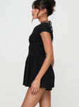 Black Playsuit V neckline, invisible zip fastening at back, pleats at waist, cap sleeve