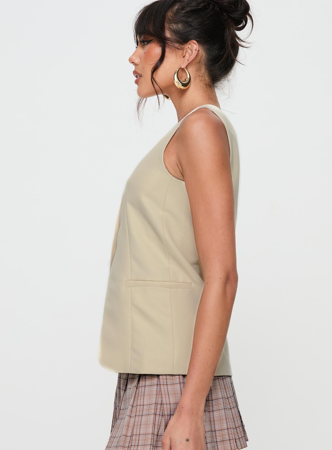 side view of model wearing Princess Polly Dovesie Vest Top Beige Sleeveless V-Neck 
