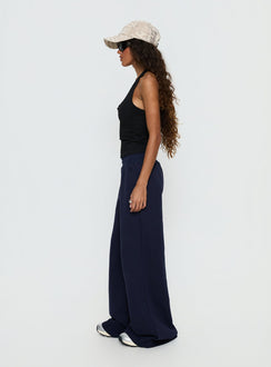 side view of model wearing Princess Polly Summits Flared Track Pants Navy Mid Rise Pants 