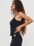 side view of model wearing Princess Polly Nesting Top Black Sleeveless Plunger 