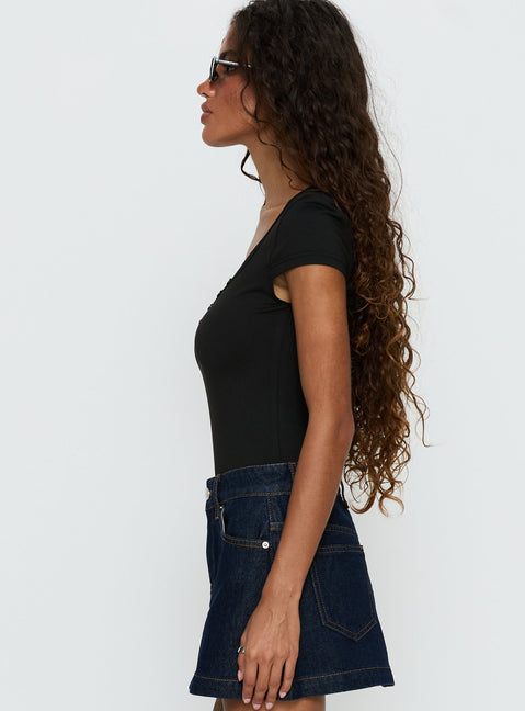 side view of model wearing Princess Polly Laretta Button Up Bodysuit Black Short Sleeve 