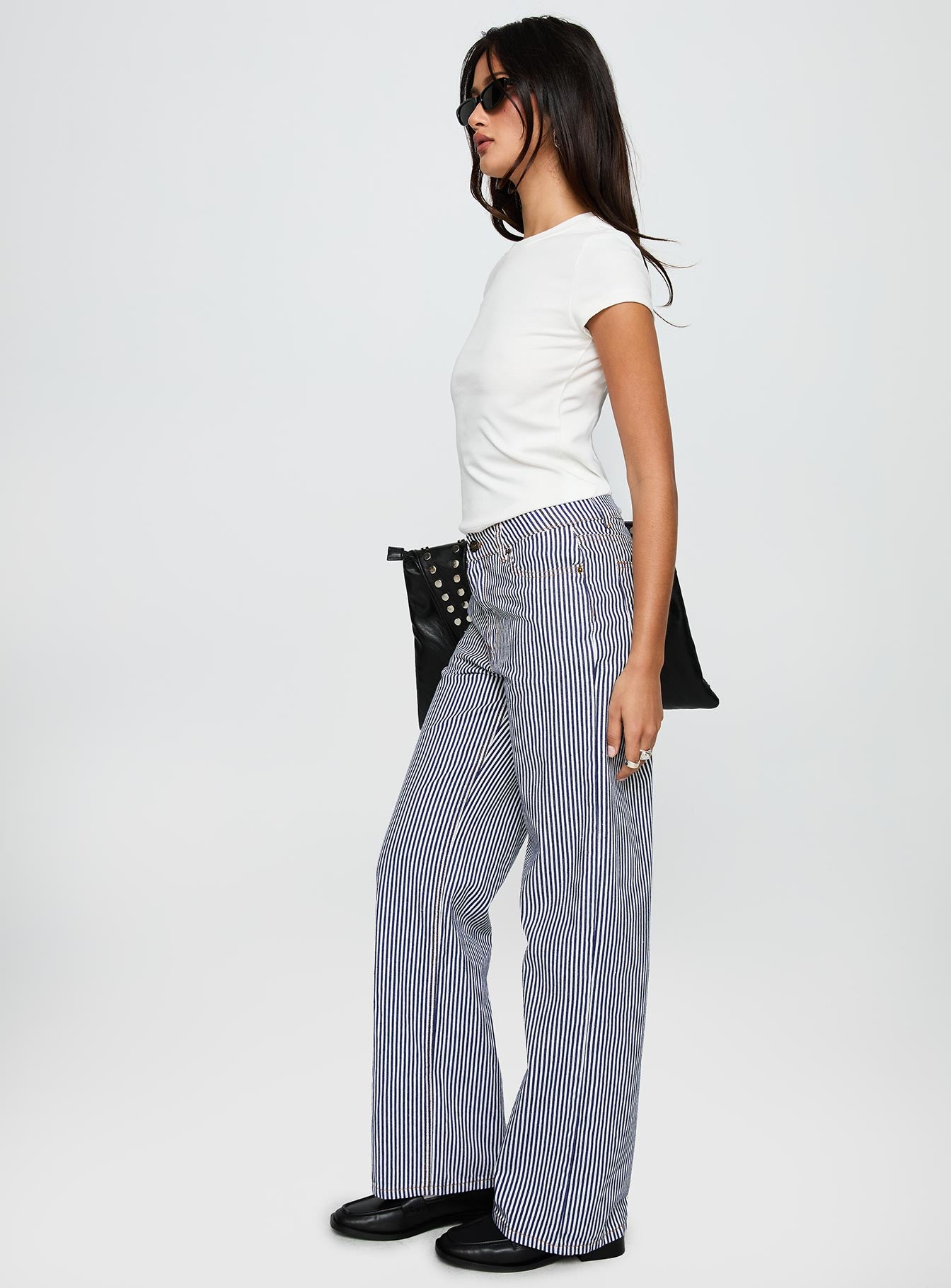side view of model wearing Princess Polly Top Model Jean Navy Stripe Low Rise Pants 