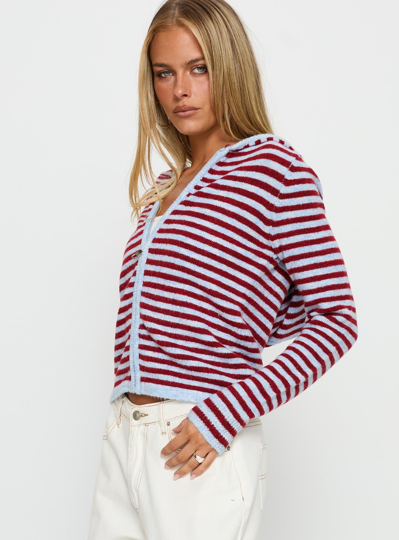 side view of model wearing Princess Polly Superstars Zip Through Hoodie Blue / Red Stripe cropped 