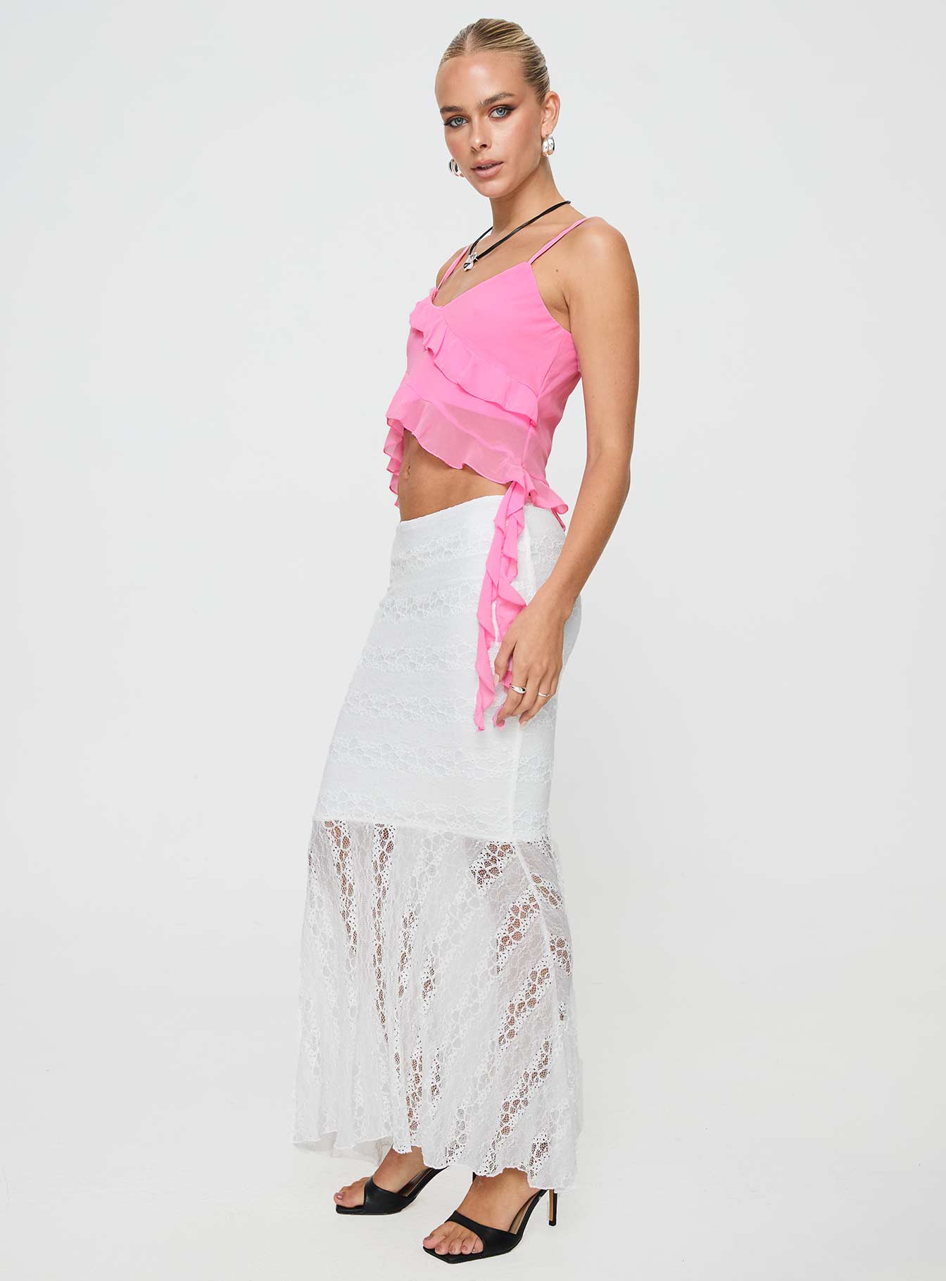   side view of model wearing Princess Polly Date Night Maxi Skirt White Maxi 