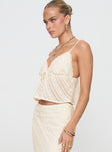 side view of model wearing Princess Polly Jacintha Top Cream Sleeveless V-Neck 