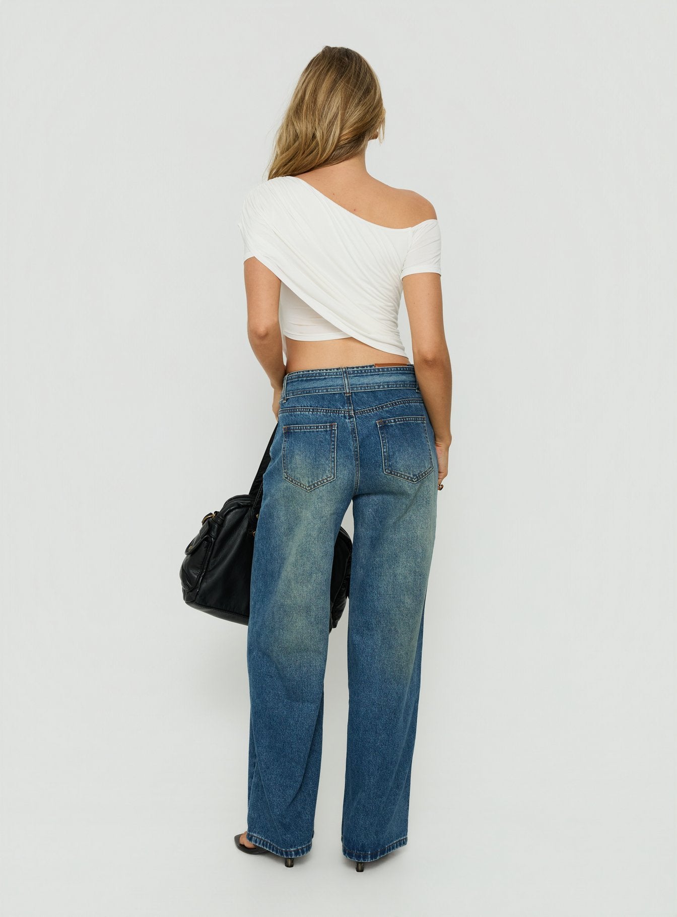 Presenting Charlotta Low Rise Super Baggy Jeans Mid Blue womens-jeans back view of model wearing Princess Polly