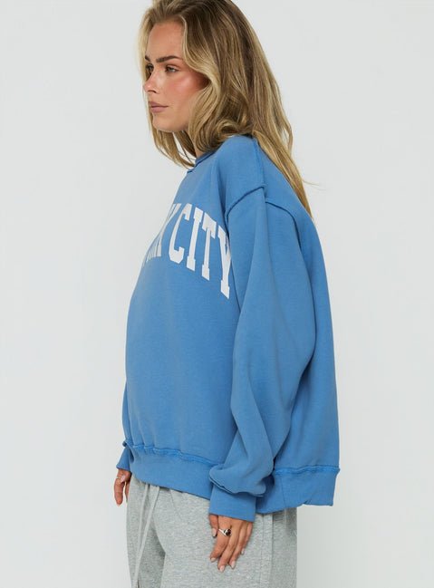 Presenting the When In New York City Oversized Jumper Blue womens jumper with long fit side view of model wearing Princess Polly