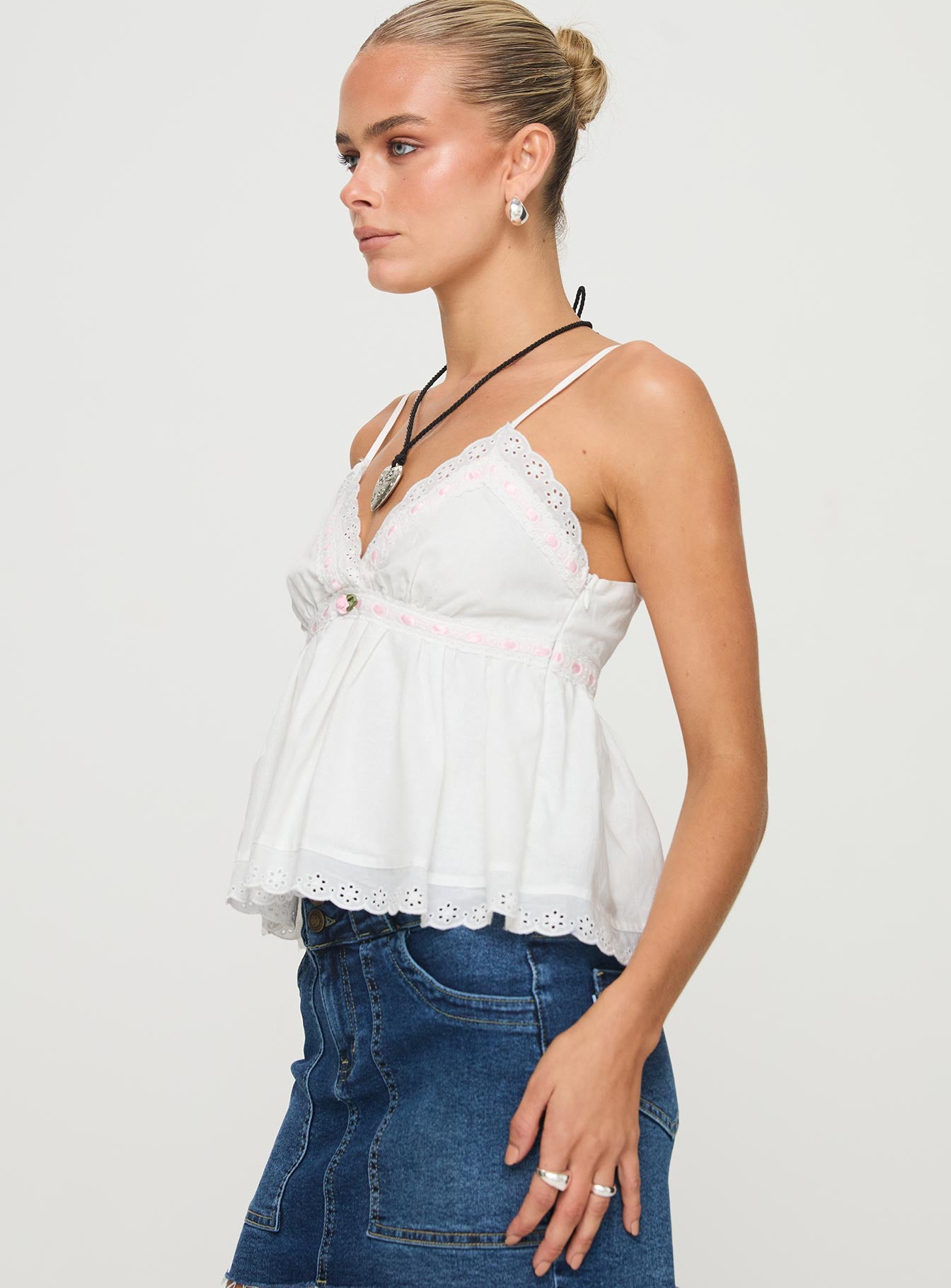 side view of model wearing Princess Polly Libra Top White Sleeveless V-Neck 