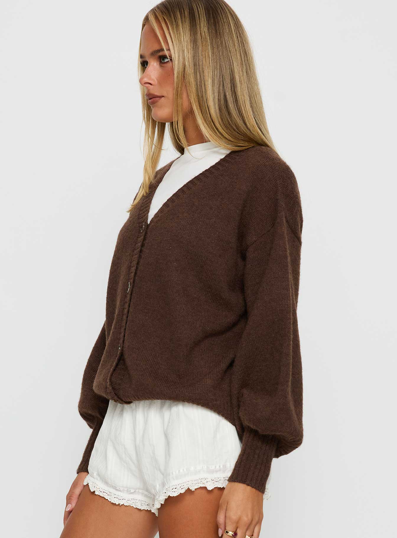 side view of model wearing Princess Polly Eartha V Neck Knit Sweater Brown Long 