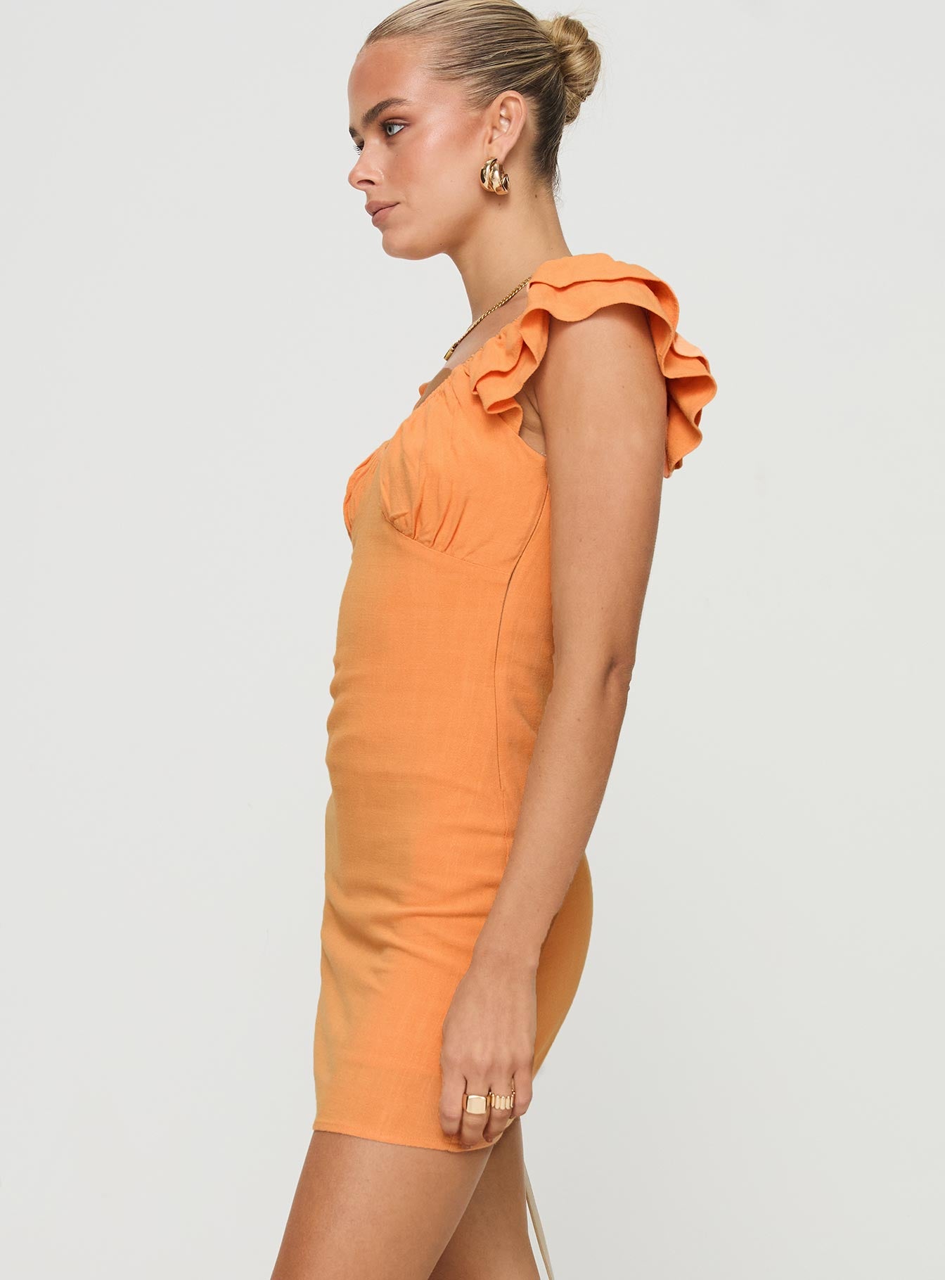 side view of model wearing Princess Polly Leto Mini Dress Orange Scoop Neck 