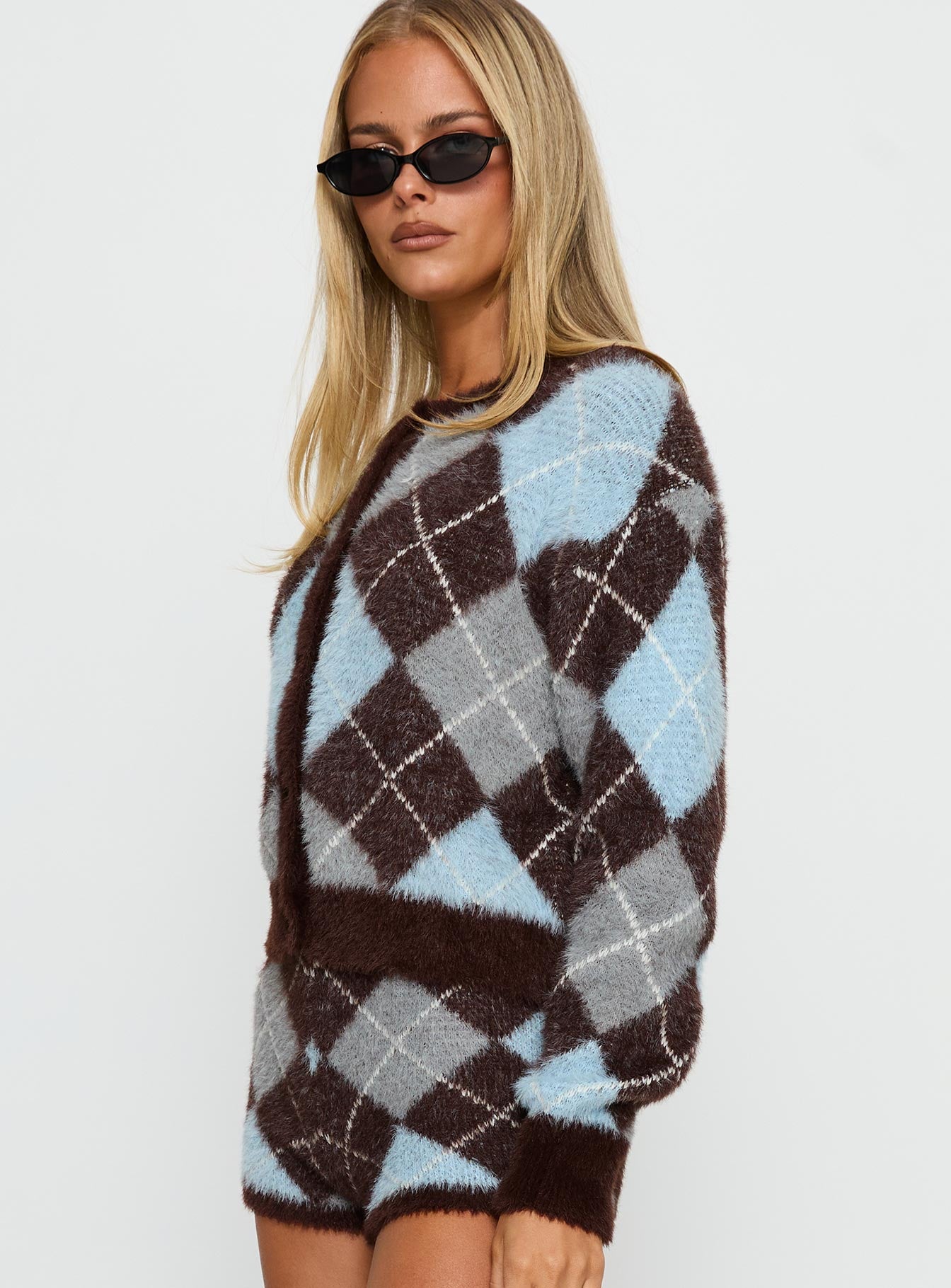 side view of model wearing Princess Polly Kenlea Button Up Cardigan Blue Argyle Cropped Jumpers 